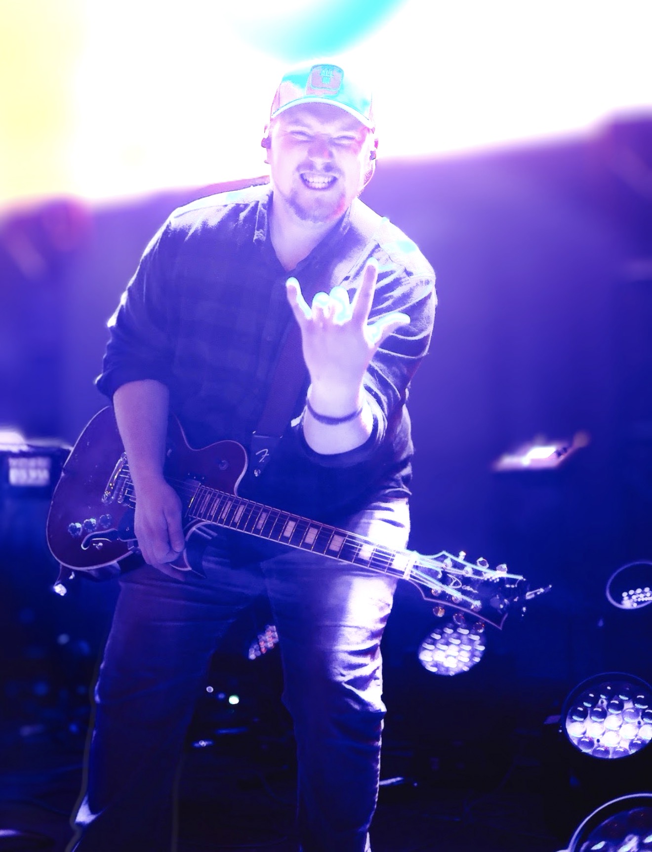 Joshua Dean performing live with guitar